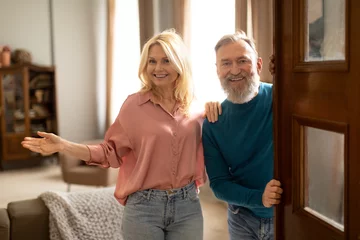 Fotobehang Oude deur Cheerful Senior Spouses Opening Door Welcoming You At Home