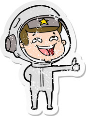 distressed sticker of a cartoon laughing astronaut