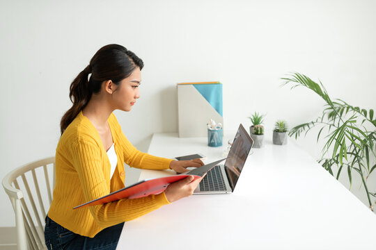 Student girl working in her room.