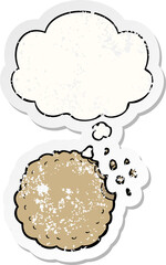 cartoon cookie and thought bubble as a distressed worn sticker