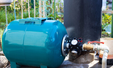 Water supply system with a hydraulic tank and a cleaning filter from a well in the country.