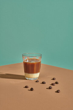 Vietnamese iced coffee with condensed milk on brown table