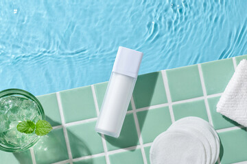 Soft towel and bath accessories on the edge of the tub