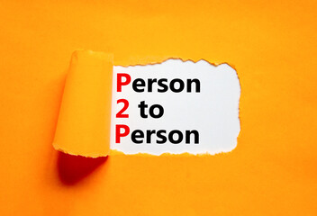 P2P person to person symbol. Concept words P2P person to person on white paper on a beautiful orange background. Business and P2P person to person concept. Copy space.