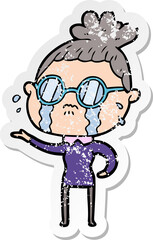 distressed sticker of a cartoon crying woman wearing spectacles