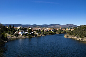 Naklejka na ściany i meble Panoramic view from the river viewpoint of the village of Buitrago del Lozoya. 