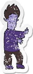 retro distressed sticker of a cartoon excited vampire