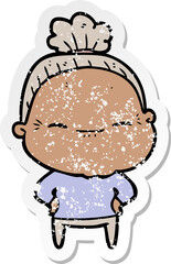 distressed sticker of a cartoon peaceful old woman