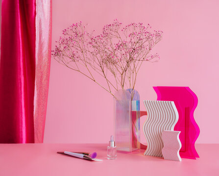 Set of various flowers in vase on table, abstract plastic objects