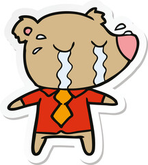 sticker of a cartoon crying bear in shirt