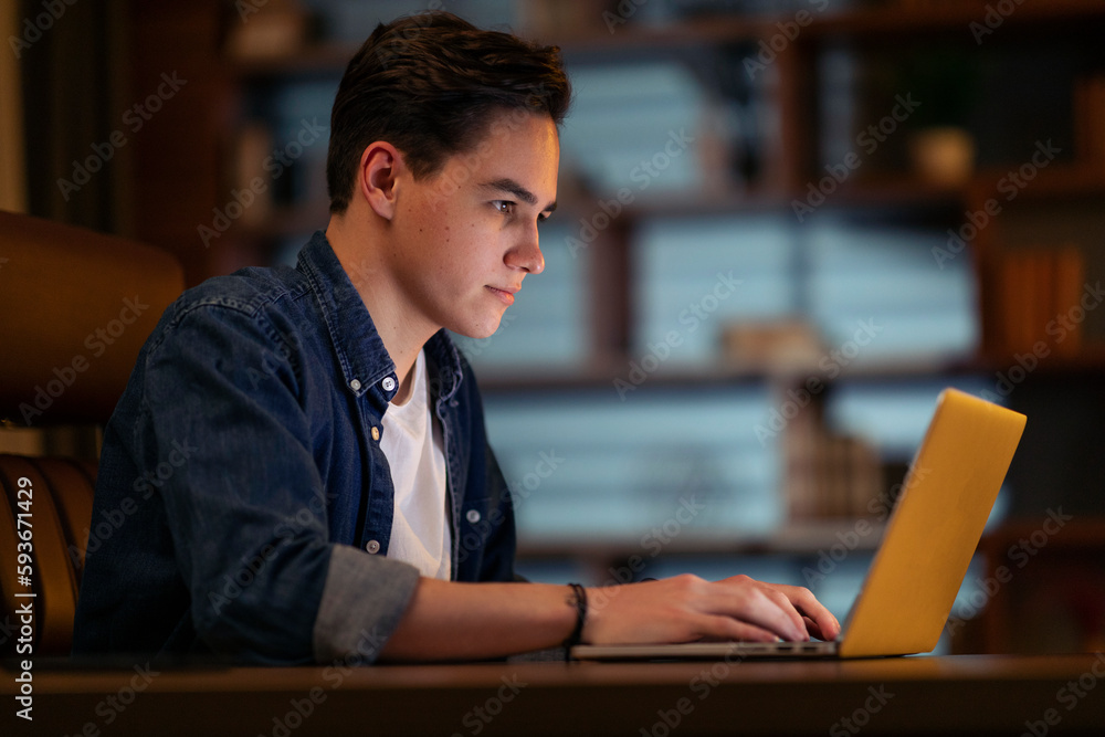 Leinwandbilder concentrated young guy developer typing on pc keyboard, coding