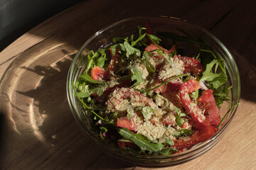 inviting salad perfect for warm summer evenings, with refreshing arugula, tomatoes, finished with a dusting of flavorful nutritional yeast. Light and Fresh Summer Salad Recipes for Outdoor Dining