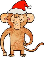 textured cartoon of a monkey scratching wearing santa hat