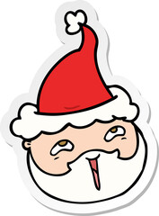sticker cartoon of a male face with beard wearing santa hat