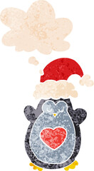 cute christmas penguin and thought bubble in retro textured style