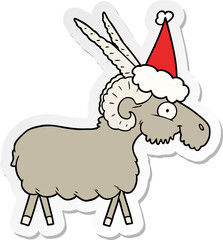 sticker cartoon of a goat wearing santa hat