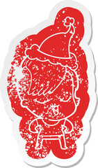 happy cartoon distressed sticker of a girl wearing santa hat
