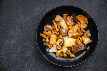 mushroom salad mix white mushroom, boletus, chanterelle appetizer meal food snack on the table copy space food background rustic top view