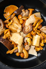 mushroom salad mix white mushroom, boletus, chanterelle appetizer meal food snack on the table copy space food background rustic top view