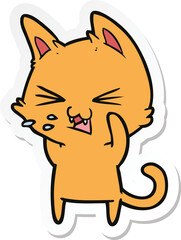 sticker of a cartoon cat hissing