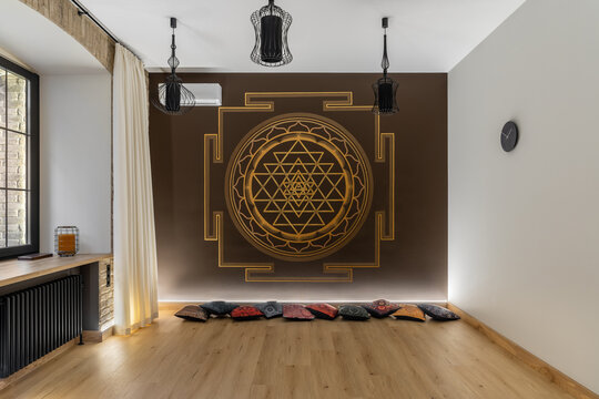Modern interior of yoga studio with hindu painting