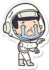 sticker of a cartoon crying astronaut