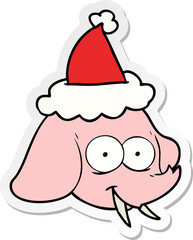 sticker cartoon of a elephant face wearing santa hat
