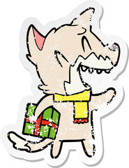 distressed sticker of a laughing christmas fox cartoon