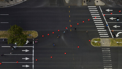 Honolulu Marathon, people running on a street in the city, Aerial top-down drone view.