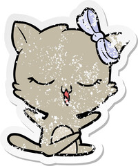 distressed sticker of a cartoon cat with bow on head