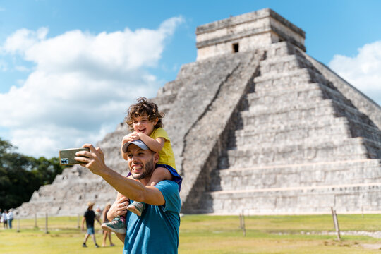 Father and daughter taking a selfie photo in Chichen Itz&aacute;, Mexico