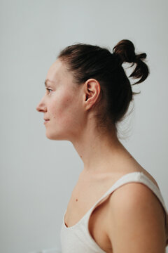 Profile portrait of natural beauty woman with hair bun