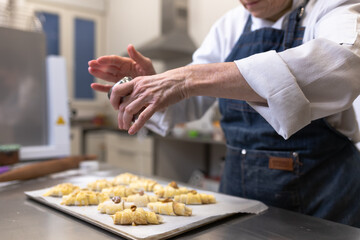 Pastry chef making sweets, rugelach and croasant