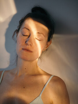Woman sun portrait with closed eyes
