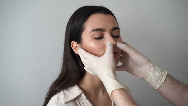 4k video septoplasty is the surgical correction of defects and deformities of the nasal septum. ENT doctor examines and palpates the nasal septum for septoplasty surgery.