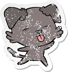 distressed sticker of a cartoon dog sticking out tongue