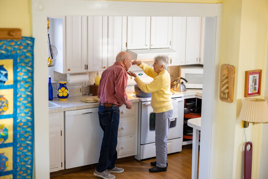 Retired Senior Citizen couple home dinner family lifestyle with soup