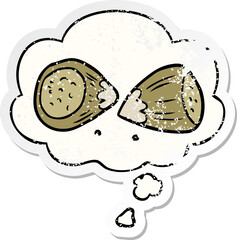 cartoon hazelnuts and thought bubble as a distressed worn sticker