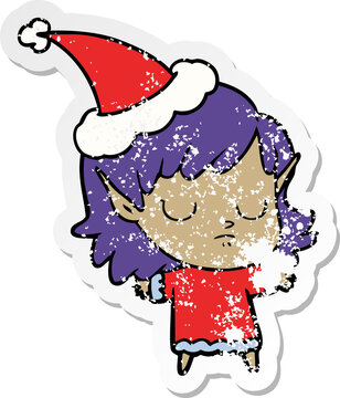 distressed sticker cartoon of a elf girl wearing santa hat
