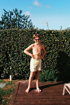 Boy in swim trunks and goggles