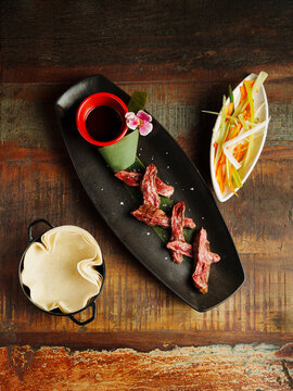 Delicious ribs served with soy sauce