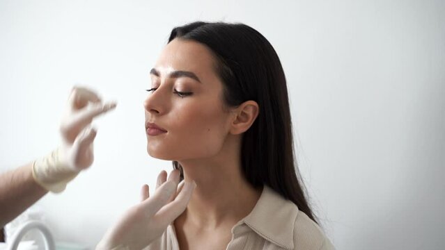 4k video ENT consultation before rhinoplasty plastic surgery. Rhinoplasty is surgical procedure that involves altering shape of nose to improve appearance and enhance breathing.