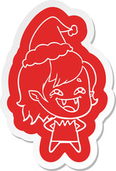 cartoon  sticker of a laughing vampire girl wearing santa hat