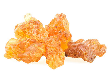 Golden frankincense resin isolated on a white background, macro. Natural frankincense Olibanum.