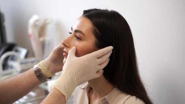 4k video ENT doctor examines and palpates the nasal septum for septoplasty surgery. Septoplasty is the surgical correction of defects and deformities of the nasal septum.