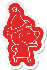 female bear cartoon  sticker of a wearing santa hat
