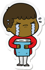 sticker of a cartoon man crying