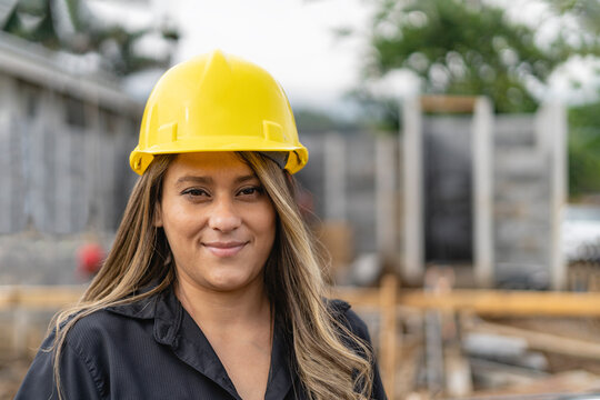 Portrait of a woman in a construction site