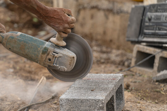 Unrecognizable man using a cutting machine