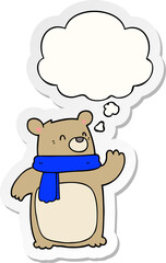 cartoon bear wearing scarf and thought bubble as a printed sticker